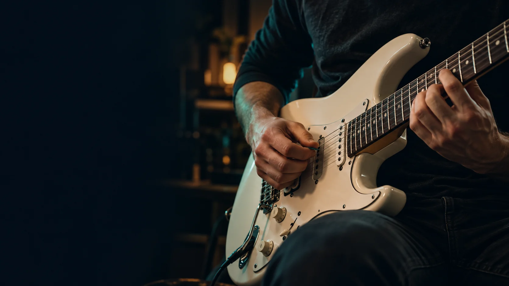 Close-up of electric guitar practice in a softly lit studio